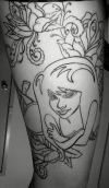 leg flower and girl face tattoo